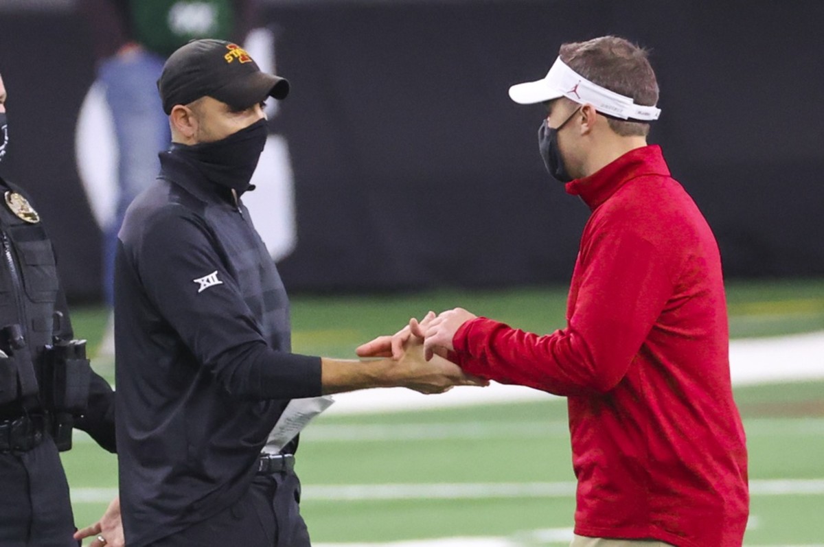 Oklahoma coach Lincoln Riley with Iowa State coach Matt Campbell